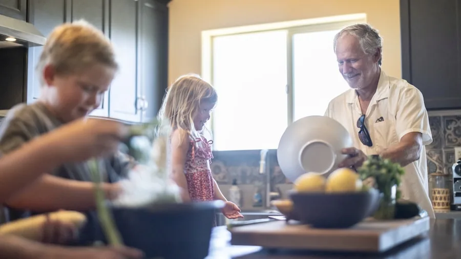 The %product_count% Best Refrigerators 6 Family discussing finances and budget planning together in modern kitchen