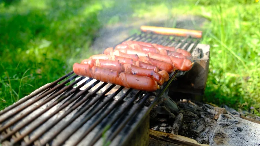 Family enjoying outdoor meal while grilling in backyard during daytime