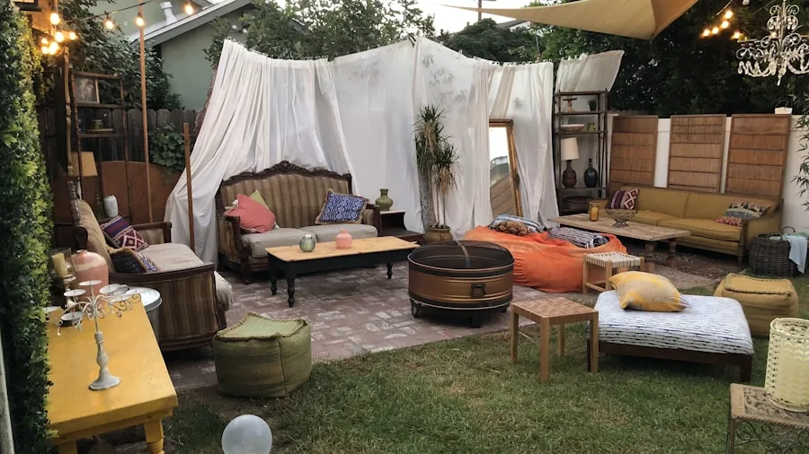 The %product_count% Best Outdoor Projectors 2 Family enjoying outdoor movie night in backyard during dusk with ambient lighting