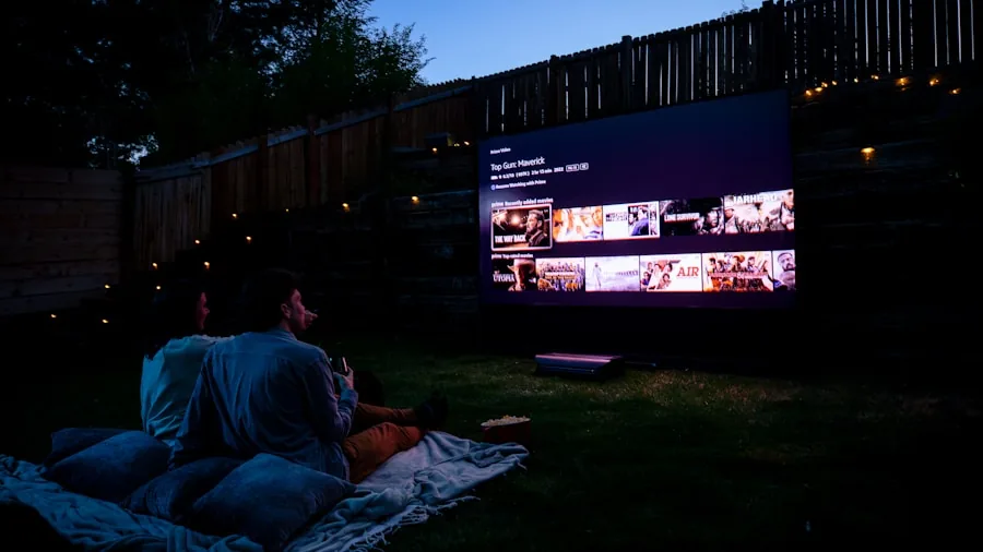 The %product_count% Best Outdoor Projectors 6 Family gathered in backyard enjoying outdoor movie projection on summer evening