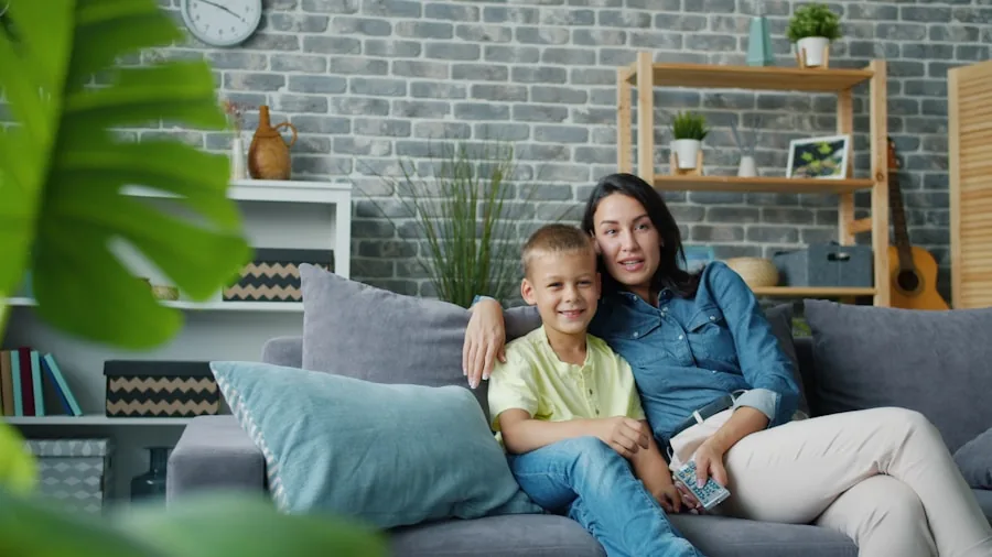 Family gathered on couch watching TV in comfortable living room setting