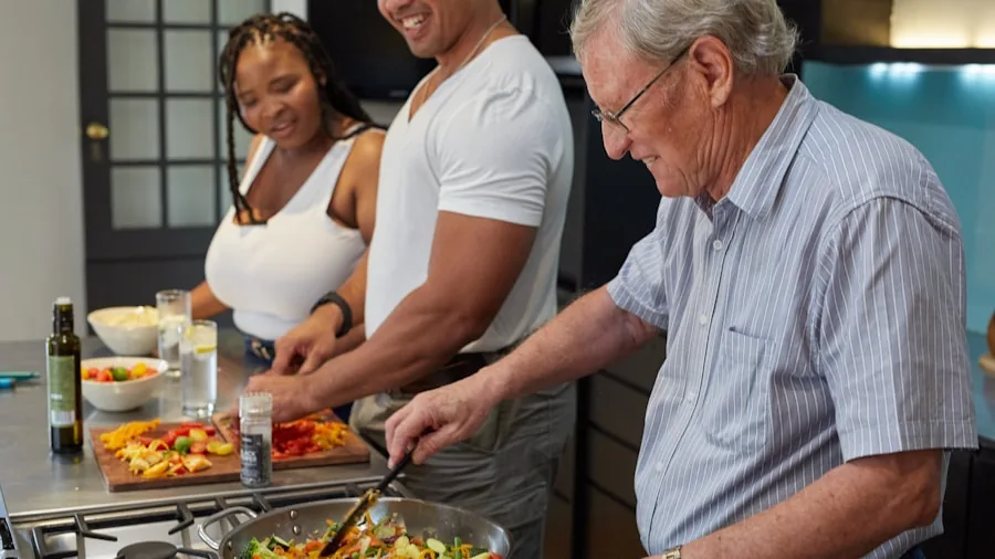 Family members preparing meal together in modern kitchen with fresh ingredients