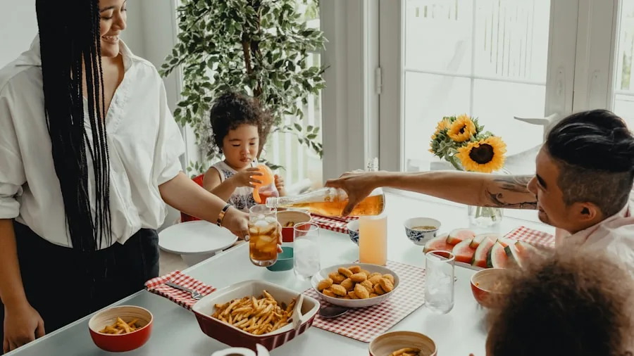Family preparing a complete meal together in a modern kitchen with multiple dishes cooking simultaneously