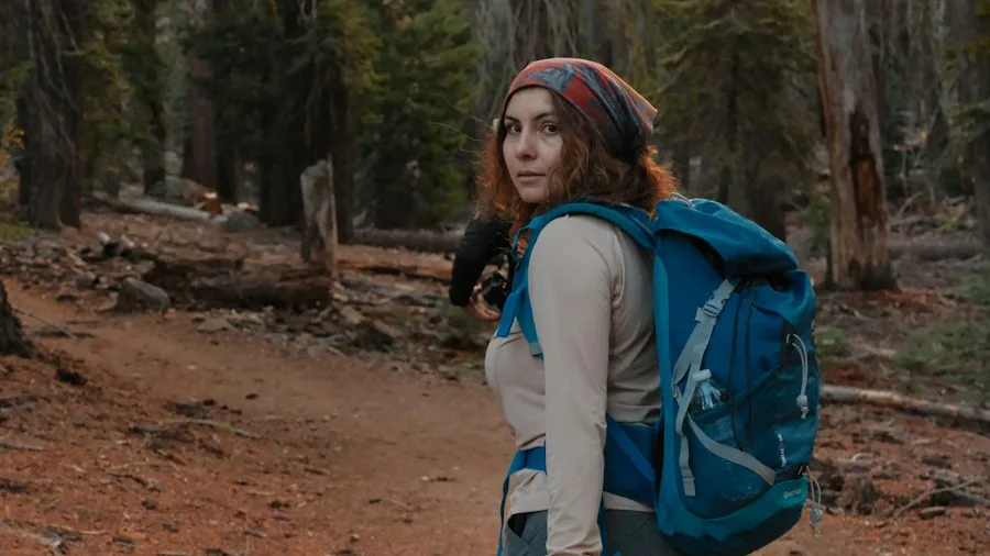 Hiking Safety After Assault: What Solo Travelers Should Know 2 female hiker forest trail equipment