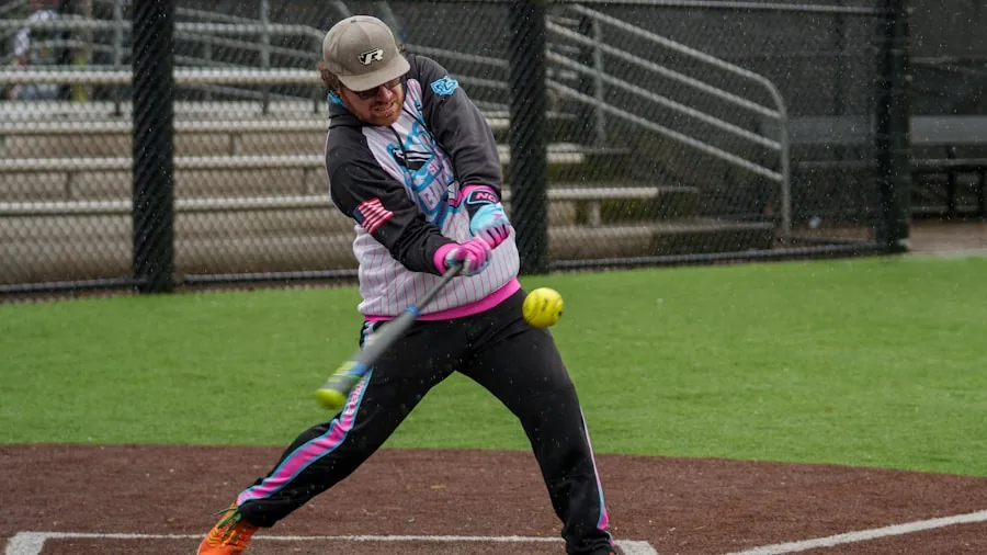 The %product_count% Best Softball Bats 2 Female softball player in batting stance during outdoor practice on sunny field
