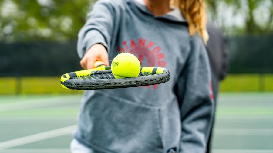 The %product_count% Best Tennis Shoes for Women 5 Female tennis player in action on outdoor court during match, demonstrating athletic movement and footwork