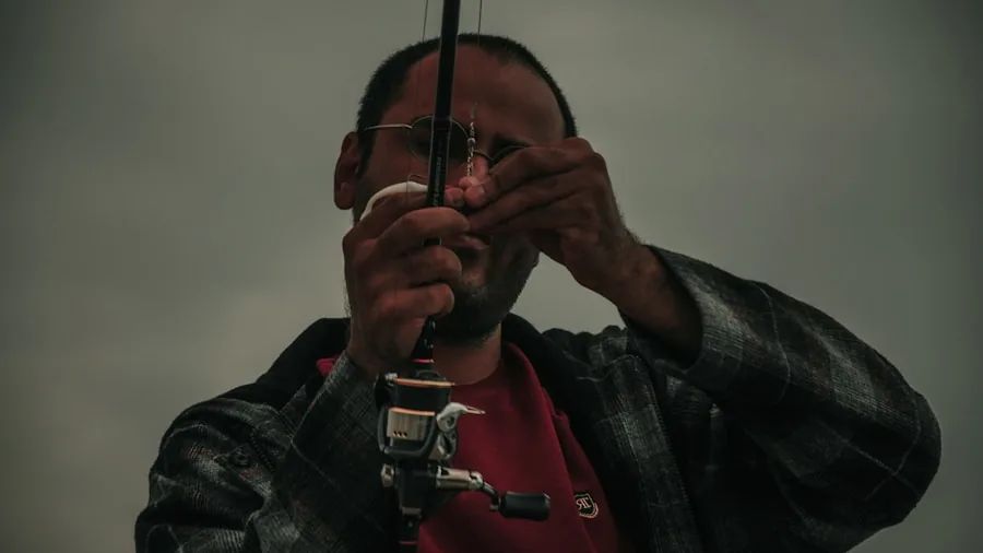 Fisherman inspecting sharp fishing hook detail with focus on quality and durability