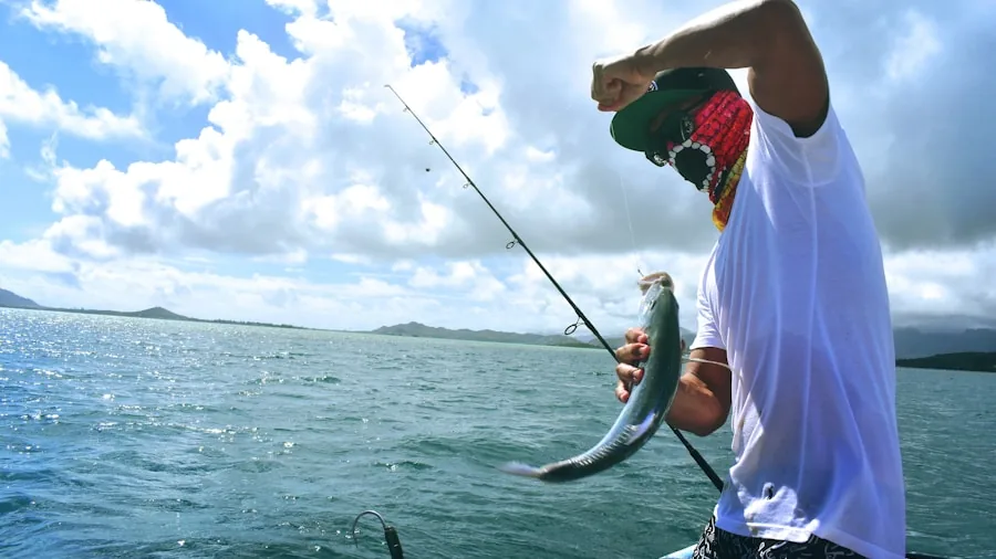 The %product_count% Best Fishing Reels Spinning 2 Fisherman using spinning reel to retrieve catch from water during daytime fishing