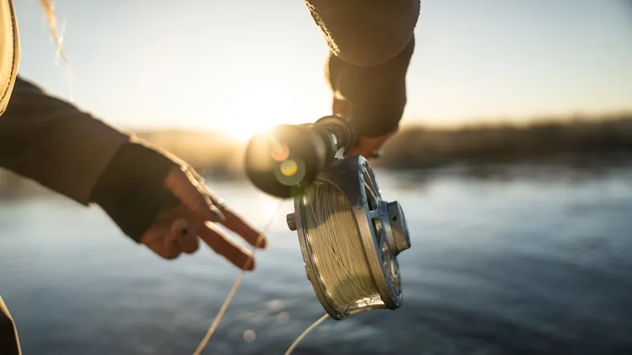 Fisherman wearing sunglasses while fishing in bright sunlight on water