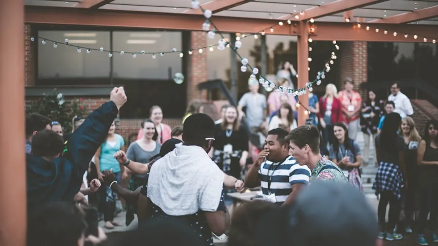 Friends enjoying music together in a backyard garden setting during daytime gathering