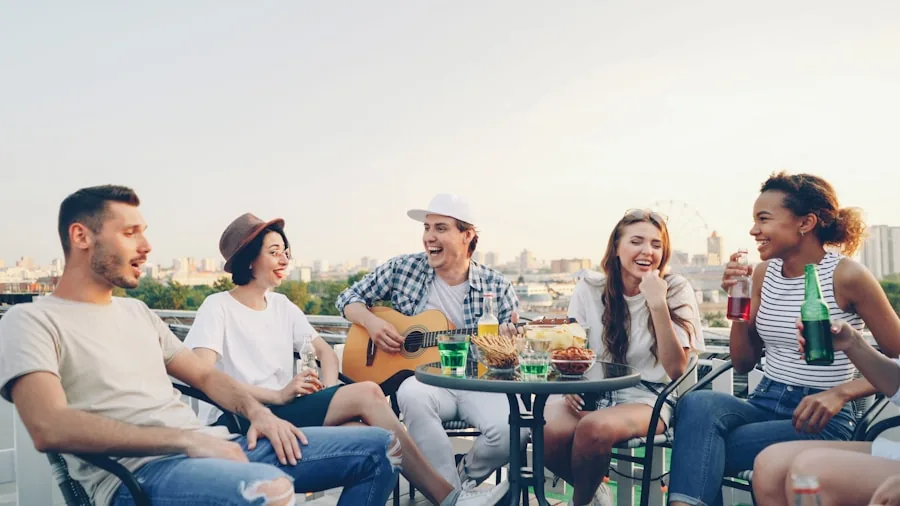 Friends enjoying music together in backyard with wireless speakers during outdoor gathering