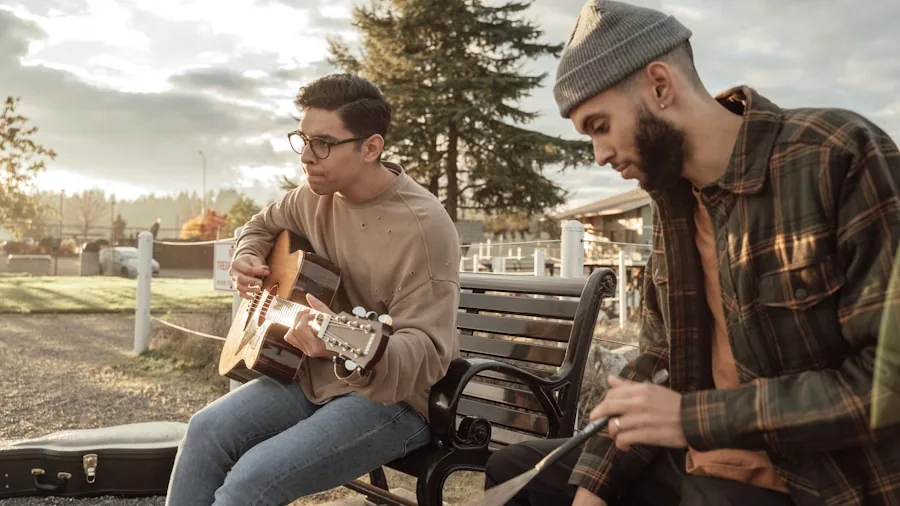 Friends enjoying music together outdoors in a natural setting