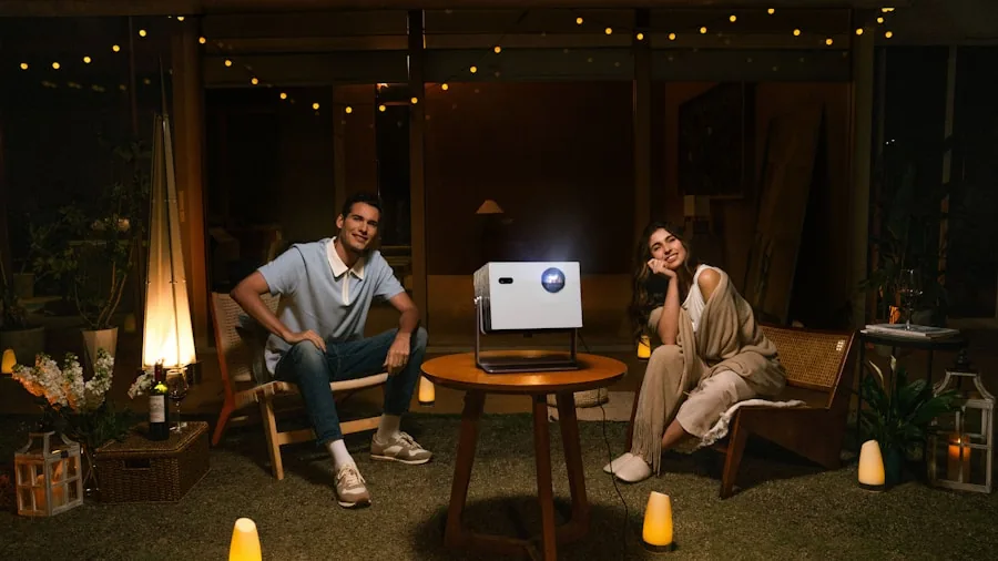 The %product_count% Best Outdoor Projectors 4 Friends enjoying outdoor movie screening in backyard at dusk with comfortable seating