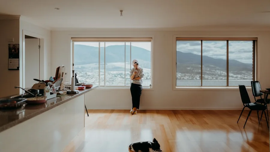 Gamer playing video games in a well-lit living room during daytime with natural sunlight