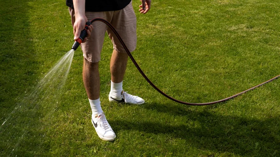 The %product_count% Best Garden Hoses 2 Gardener using a durable hose in backyard, dragging it across gravel and concrete during yard maintenance