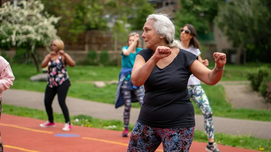 Fitness Over 40: What Personal Trainers Are Learning From Senior Athletes About Lasting Movement 3 group fitness class with older adults dancing