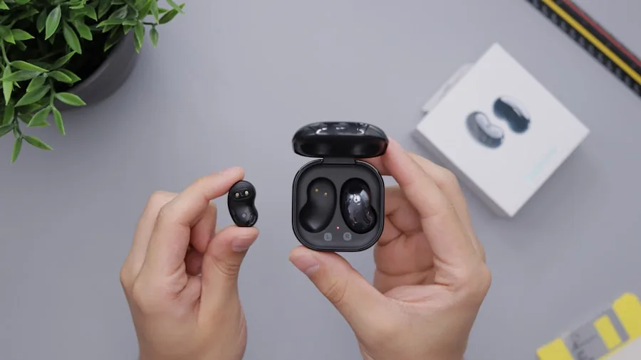 hands adjusting earbud fit