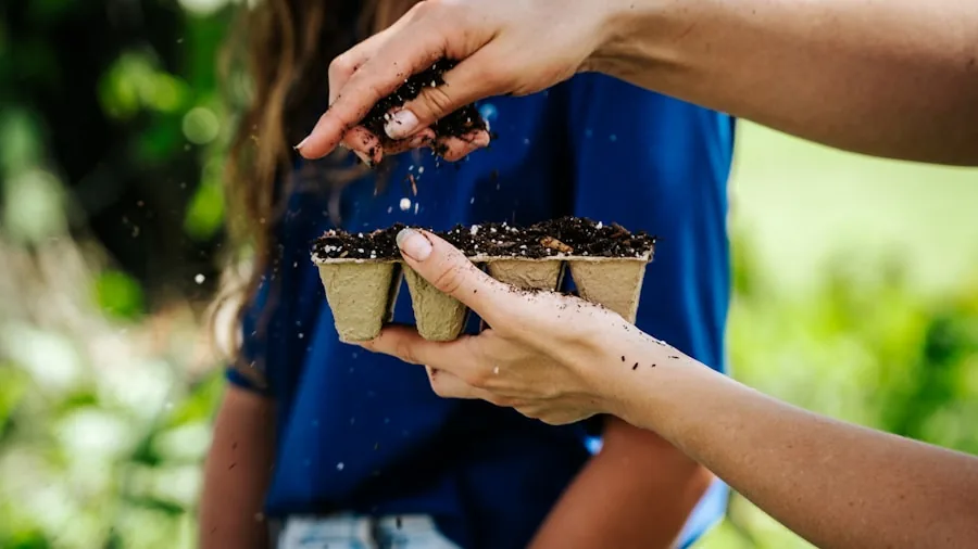 Tomato Feed Extends Patio Plant Blooms Into Fall: What Shoppers Need to Know 2 hands applying liquid fertilizer potted flowers