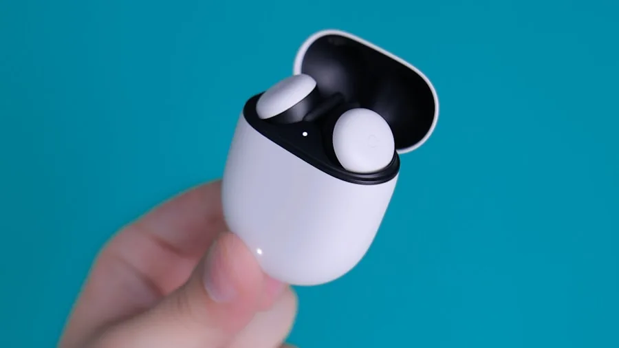 Plaud One Earbuds Launch with Built-In Recording and AI: What Shoppers Need to Know 2 hands holding earbuds charging case