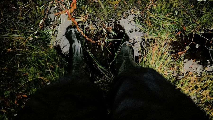 The %product_count% Best Hiking Boots 2 Hiker in waterproof boots walking through dewy grassland on misty morning trail