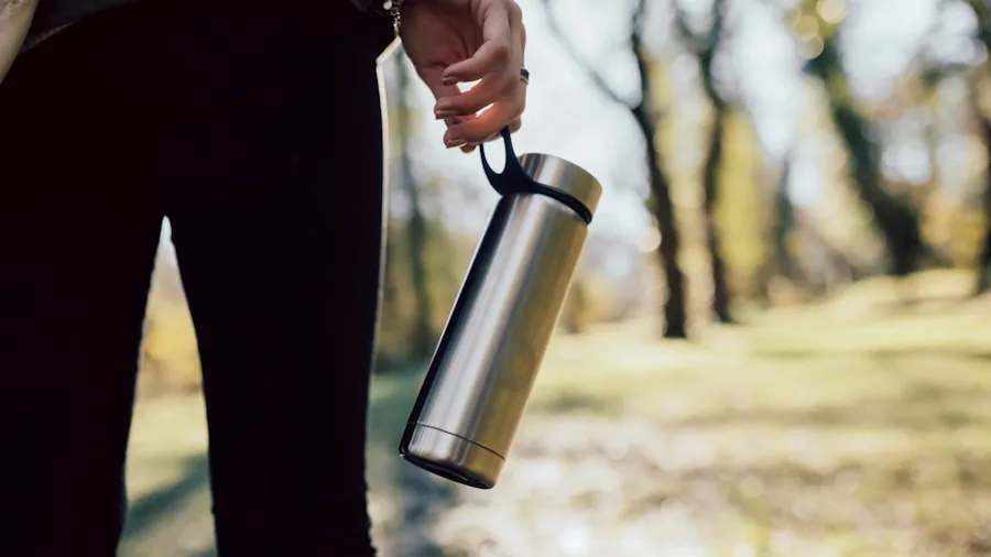 Hiker with water bottle in backpack during outdoor trail adventure