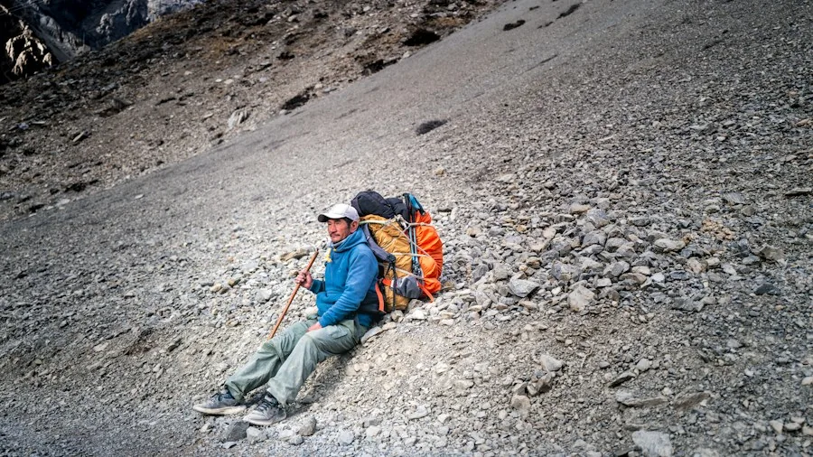 hikers with proper gear on slope