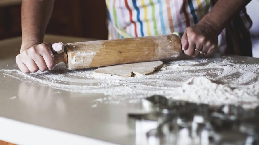 The %product_count% Best Stand Mixers 3 Home baker mixing dough ingredients in a bright kitchen workspace with baking tools and bowls