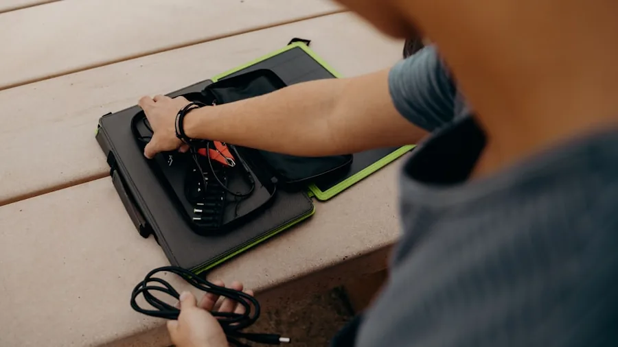 Homeowner connecting battery-powered lawn mower to charger in garage before yard work