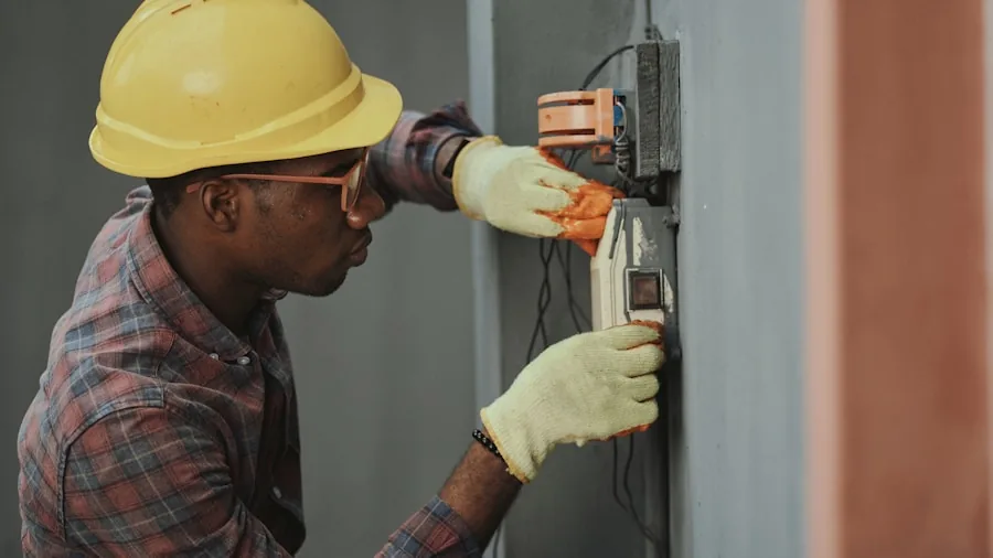 The 11 Best Smart Thermostats 2 Homeowner inspecting thermostat wiring and HVAC system connections in residential home