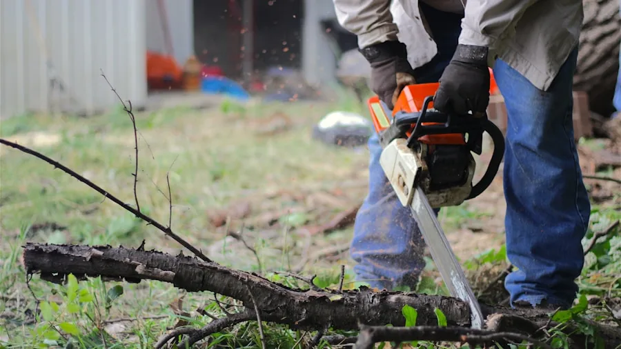 The %product_count% Best Chainsaws 2 Homeowner operating an electric chainsaw while maintaining trees in a residential garden setting