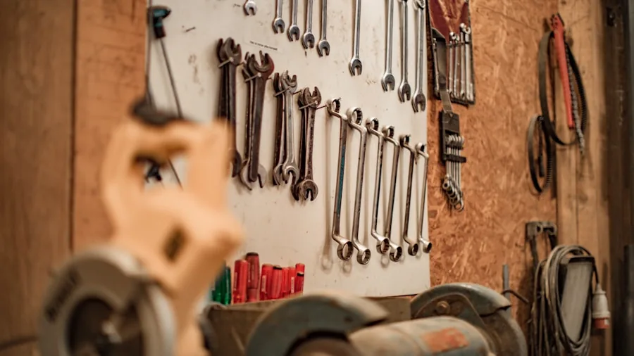 Homeowner organizing and cleaning garage workshop space with storage solutions