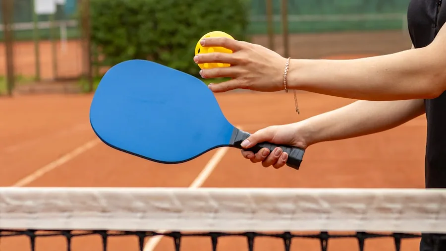 Intermediate pickleball player demonstrating paddle swing technique during court practice