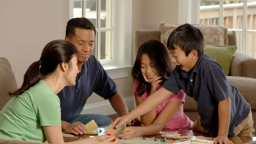 Kids gathered around table playing board game, multiple players engaged in gameplay