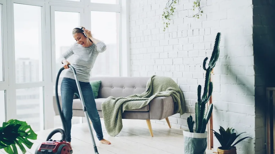 The 15 Best Upright Vacuums 3 Person vacuuming living room floor to remove dust and allergens from home