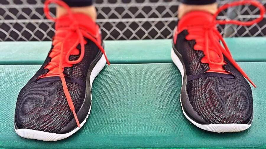 male runner interval training track