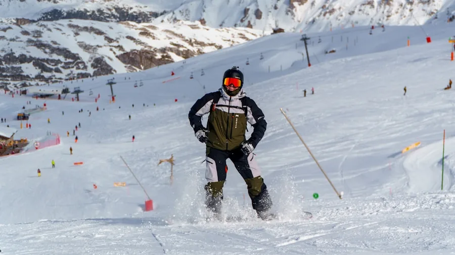 The %product_count% Best Ski Jackets for Men 3 Male skier in motion descending snowy mountain slope wearing winter gear