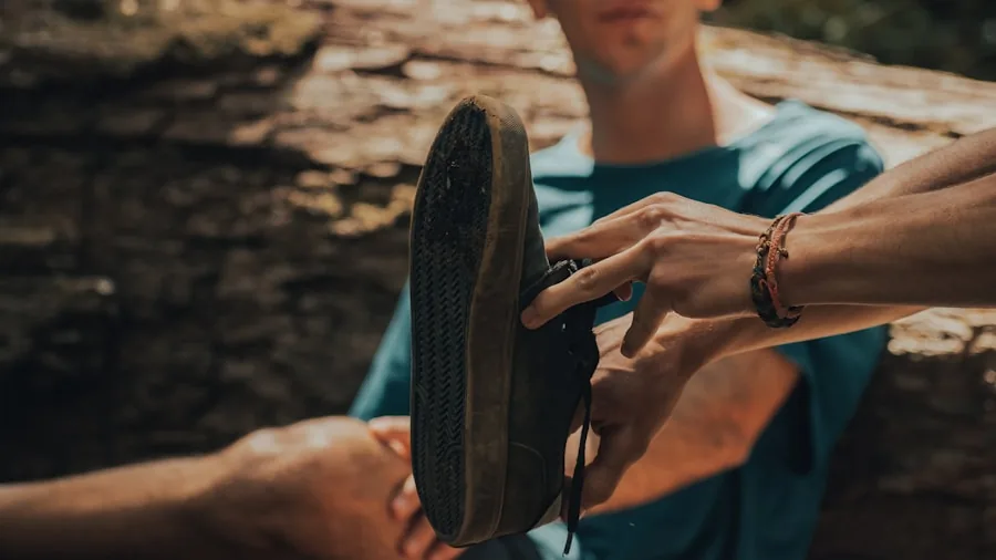 Man examining running shoe fit and comfort while sitting, focused on proper footwear selection