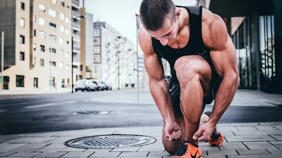 Man sitting on bench trying on athletic shoes in natural daylight indoors