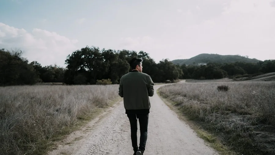 Man walking on path with confident posture, demonstrating proper walking form and comfort