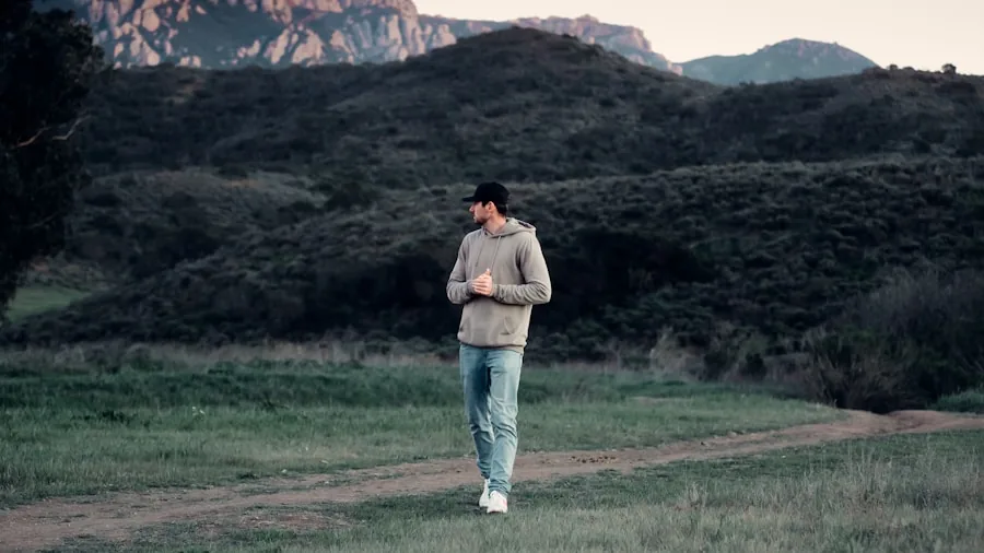 Man walking outdoors on sunny day wearing breathable athletic clothing, demonstrating proper footwear for warm weather