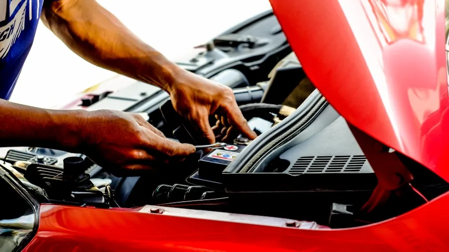 The %product_count% Best Spark Plugs 2 Mechanic examining car engine during routine maintenance and inspection service