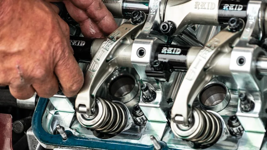 The %product_count% Best Spark Plugs 3 Mechanic examining engine components and technical specifications in garage workshop