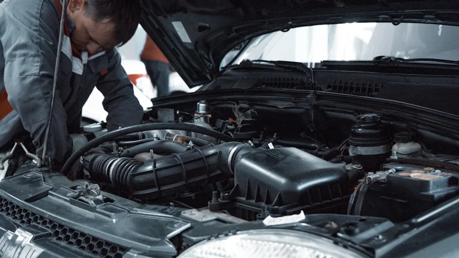 mechanic hands working on car engine