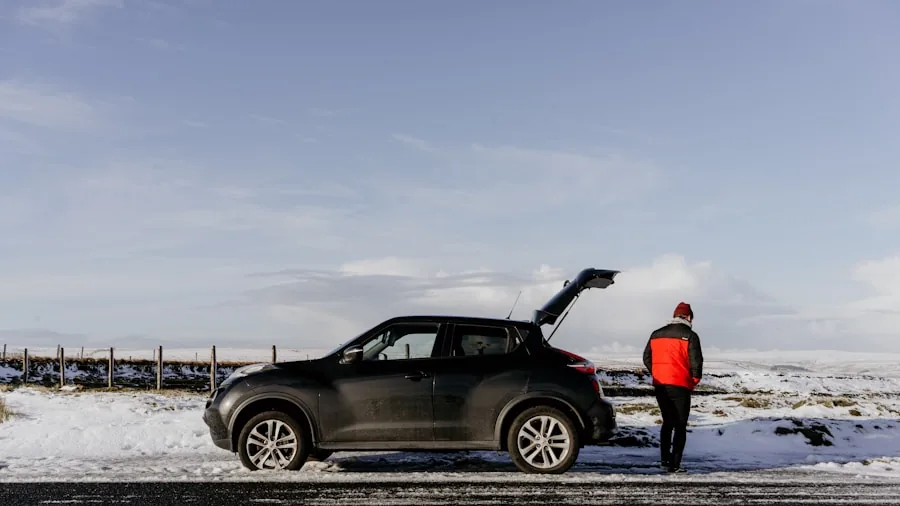 Mechanic inspecting vehicle engine in cold weather conditions