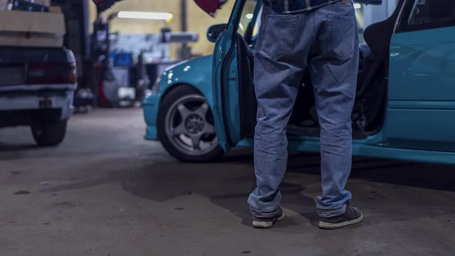 mechanic repairing car door