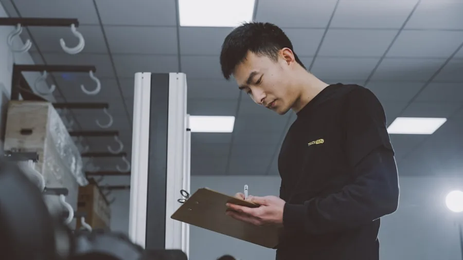 The %product_count% Best Brake Pads 3 Mechanic reviewing vehicle documentation and specifications before repair work