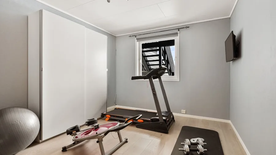 The %product_count% Best Stationary Bikes for Home 6 Minimalist home gym setup in small bedroom corner with exercise bike in compact space