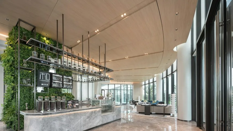 Specialty Coffee Shop Design Takes a Bold Turn in Barcelona with New Layout Strategy 2 modern cafe curved counter design