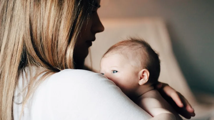 Mother nursing infant with proper posture and back support while seated comfortably