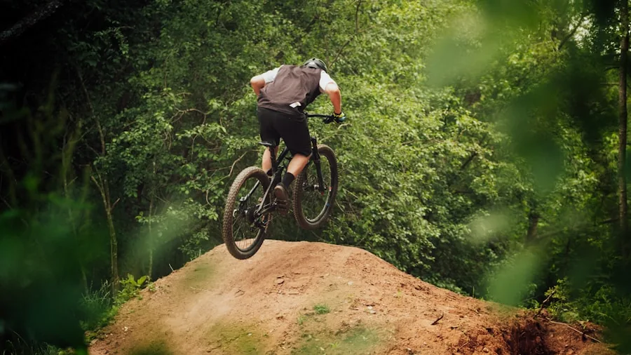The %product_count% Best Mountain Bikes 3 Mountain biker pedaling uphill on forest trail with trees and natural landscape